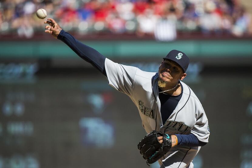 Seattle Mariners starting pitcher Felix Hernandez throws a pitch during the fourth inning...
