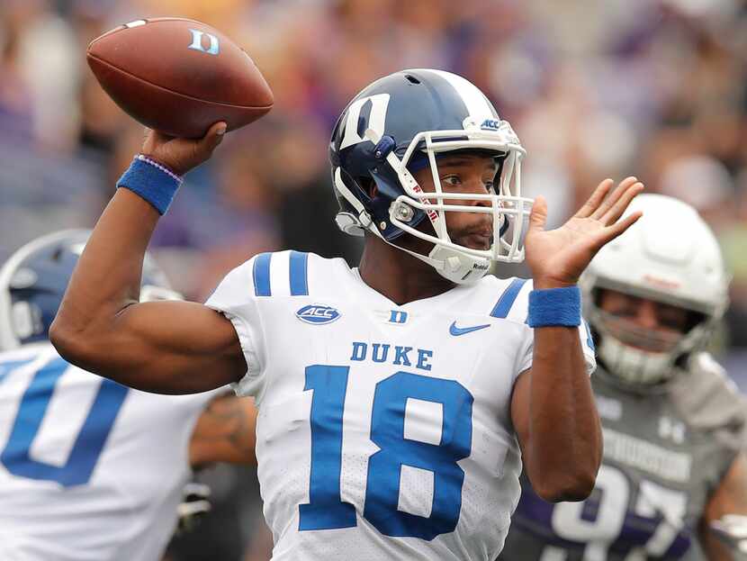 FILE - In this Sept. 8, 2018, file photo, Duke's Quentin Harris throws a pass during the...