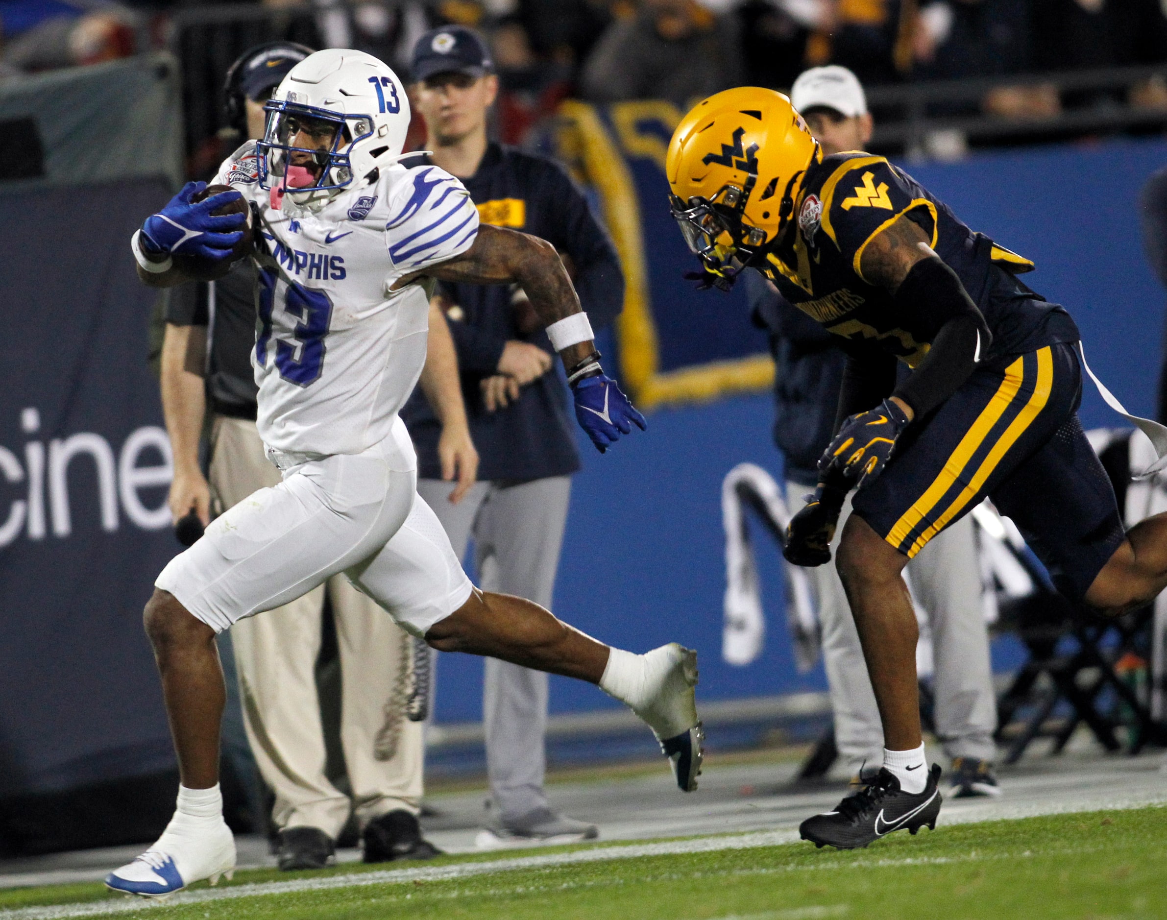 Memphis running back Greg Desrosiers Jr. (13), left, scampers past the pursuit of West...