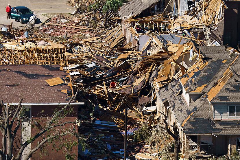 Damaged homes near Walnut Hill and Marsh Lane are seen in aerial view of tornado damage on...