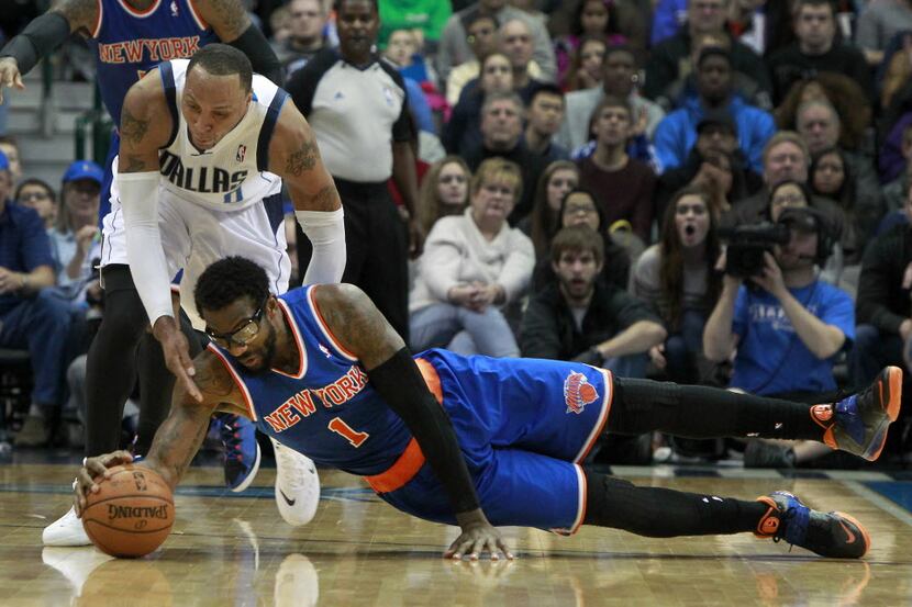 New York Knicks power forward Amar'e Stoudemire (1) lays out for a loose ball in front of...