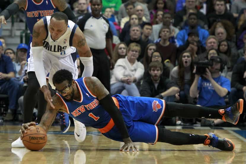 New York Knicks power forward Amar'e Stoudemire (1) lays out for a loose ball in front of...