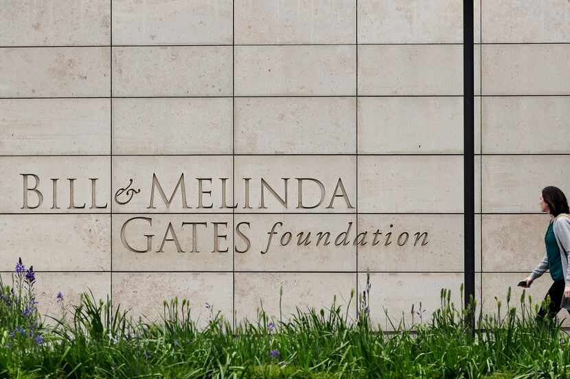 A person walks by the headquarters of the Bill and Melinda Gates Foundation in Seattle. The...