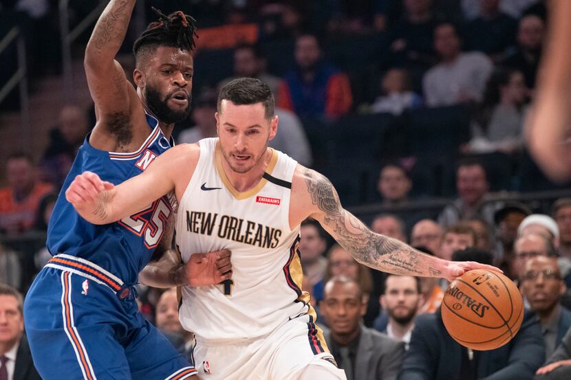 Pelicans guard JJ Redick (4) drives by Knicks guard Reggie Bullock (25) during the first...