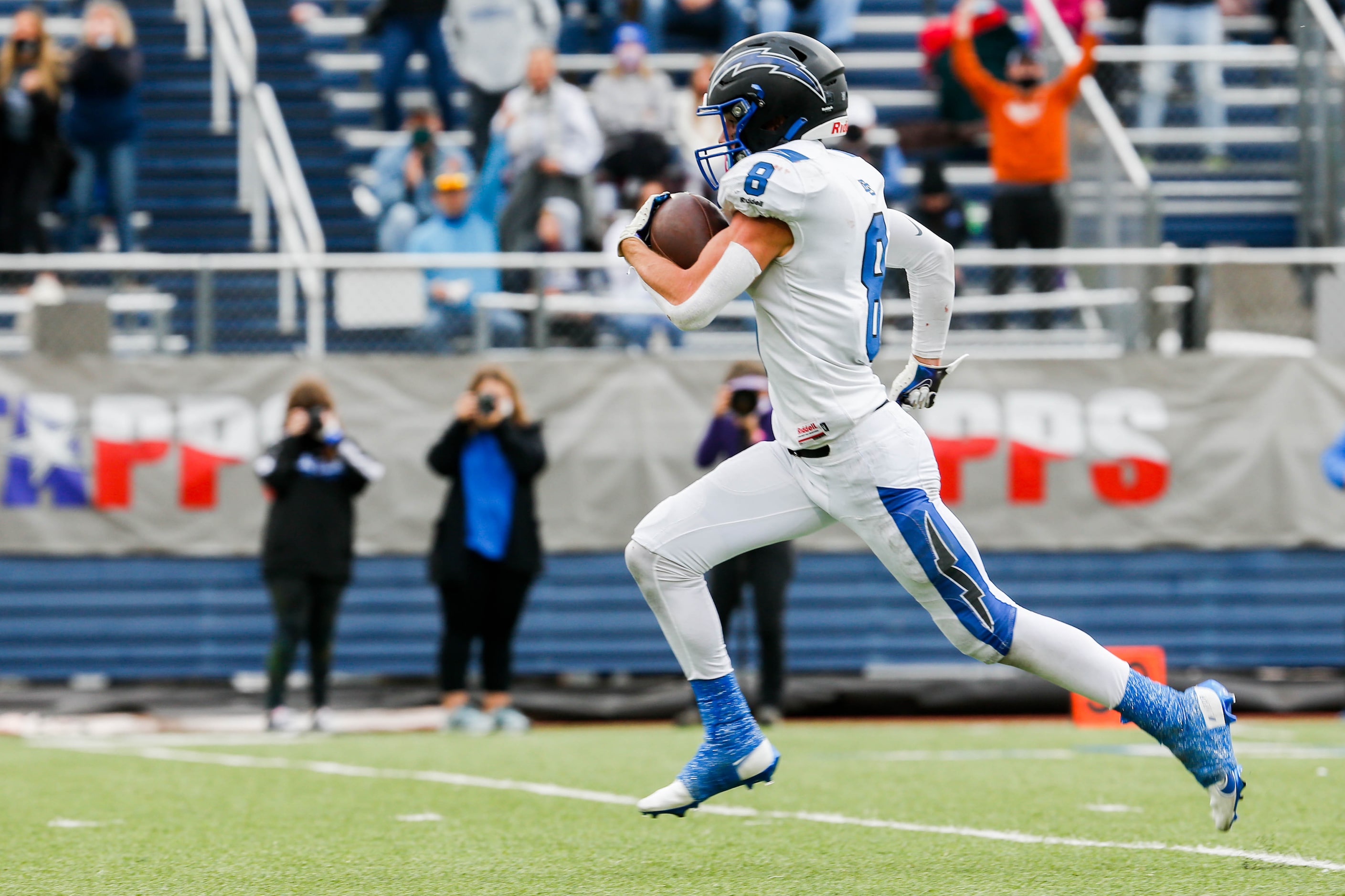 Dallas Christian's Parker Robertson (8) runs in a touchdown against Austin Regents during...