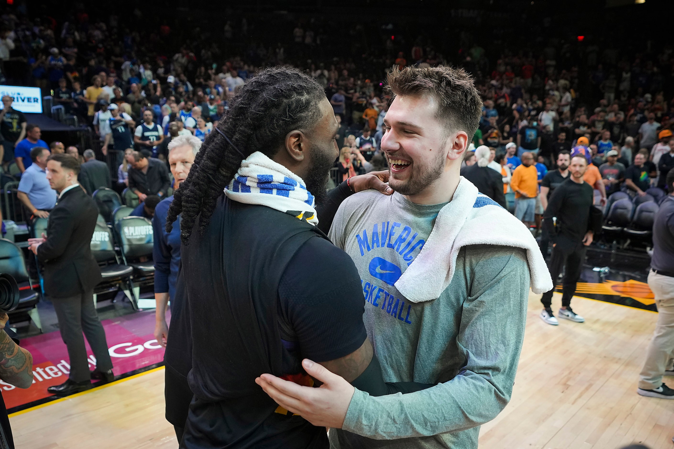 Dallas Mavericks guard Luka Doncic hugs Phoenix Suns forward Jae Crowder after Game 7 of an...