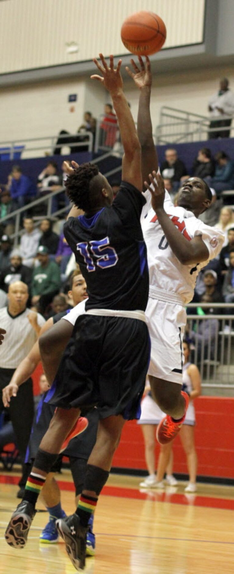 Dallas Kimball guard Jawun Evans (0) goes up for a jump shot over the defense of Mansfield...