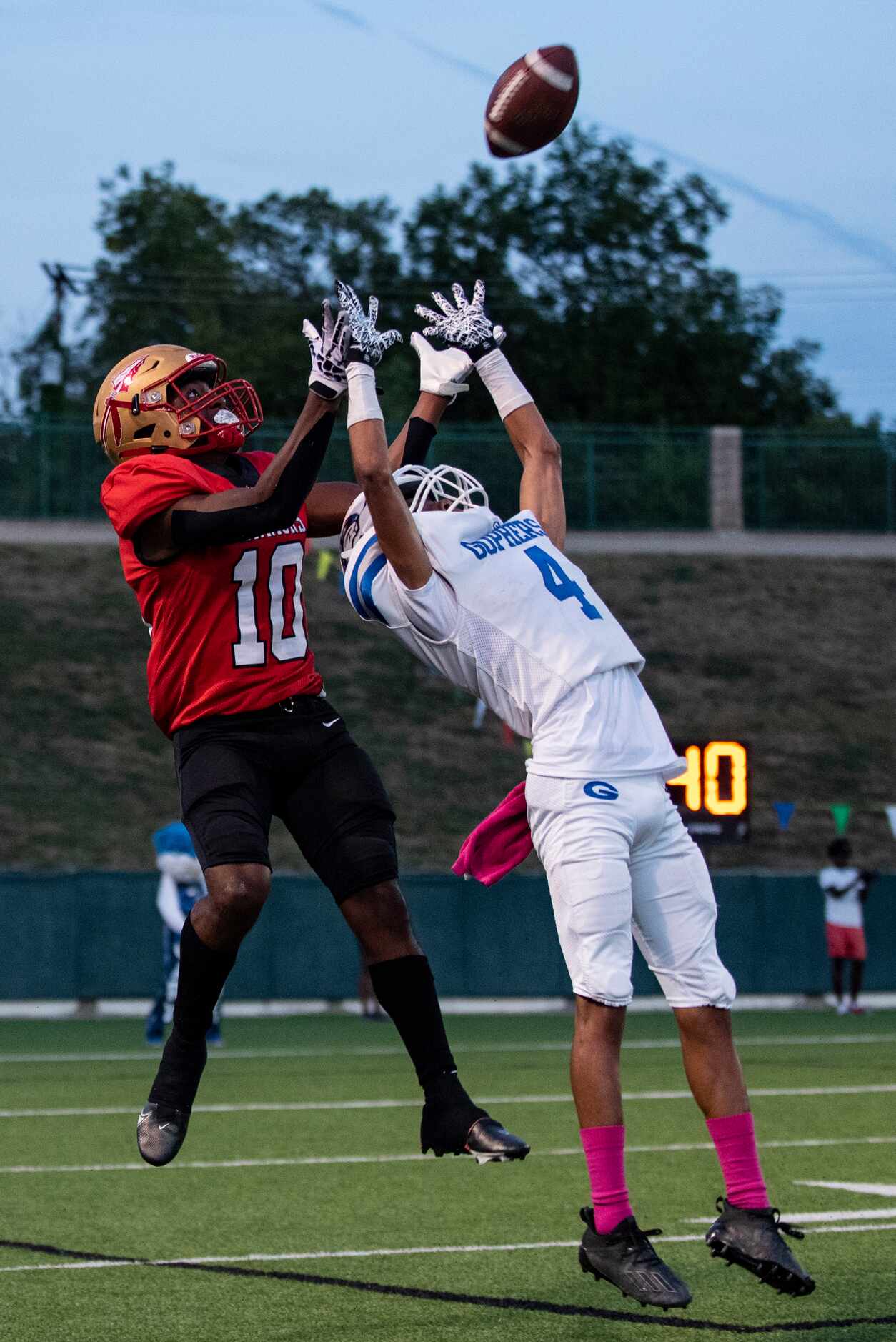 From left, South Grand Prairie junior Matthew Ramirez (10) leaps to catch a pass over Grand...