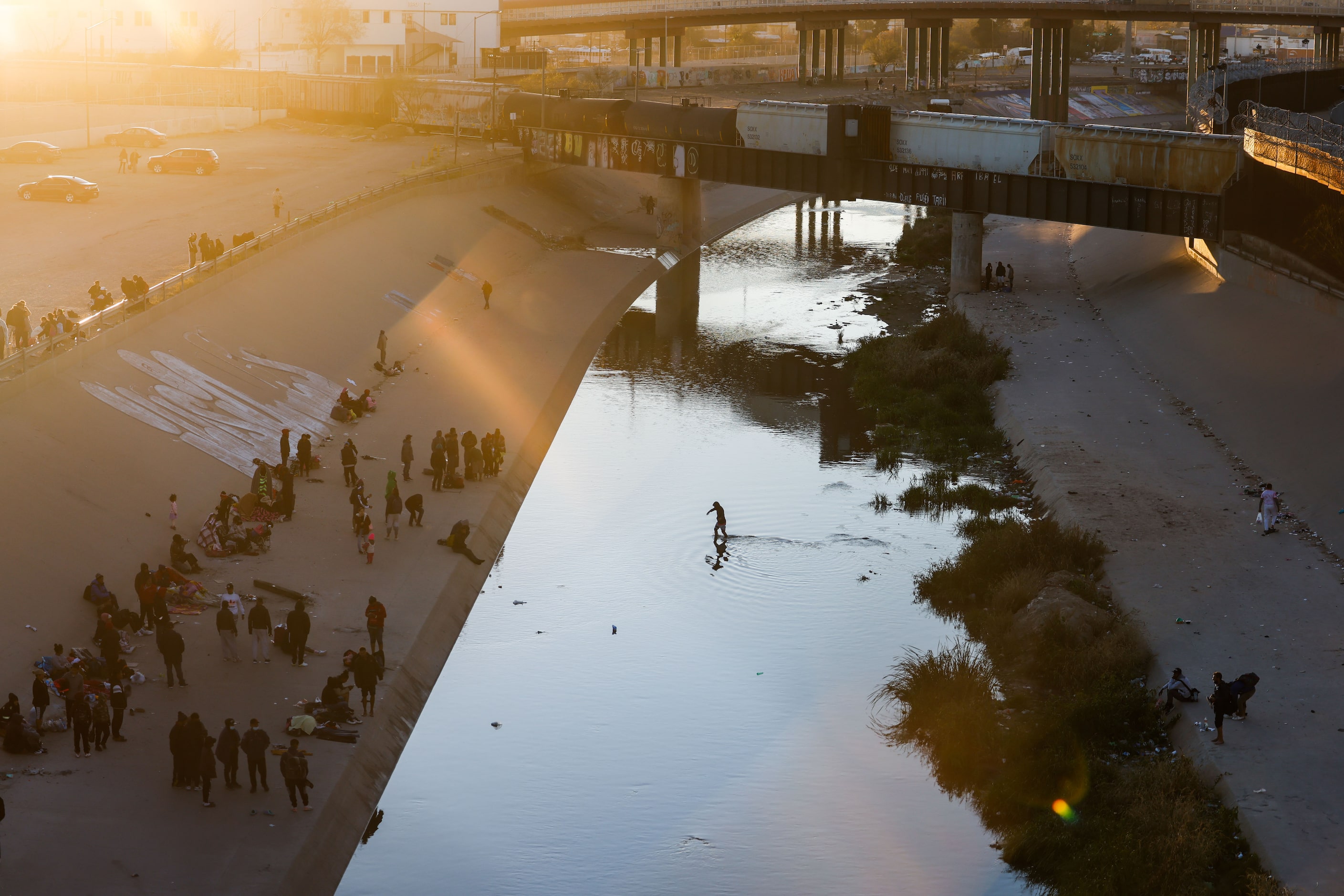 Migrants wait at the Mexican side of the border in Ciudad Juarez, Chihuahua state, Mexico on...