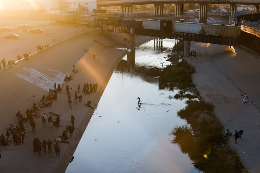 Migrants waited at the Mexican side of the border in Ciudad Juarez, Mexico, on Wednesday,...