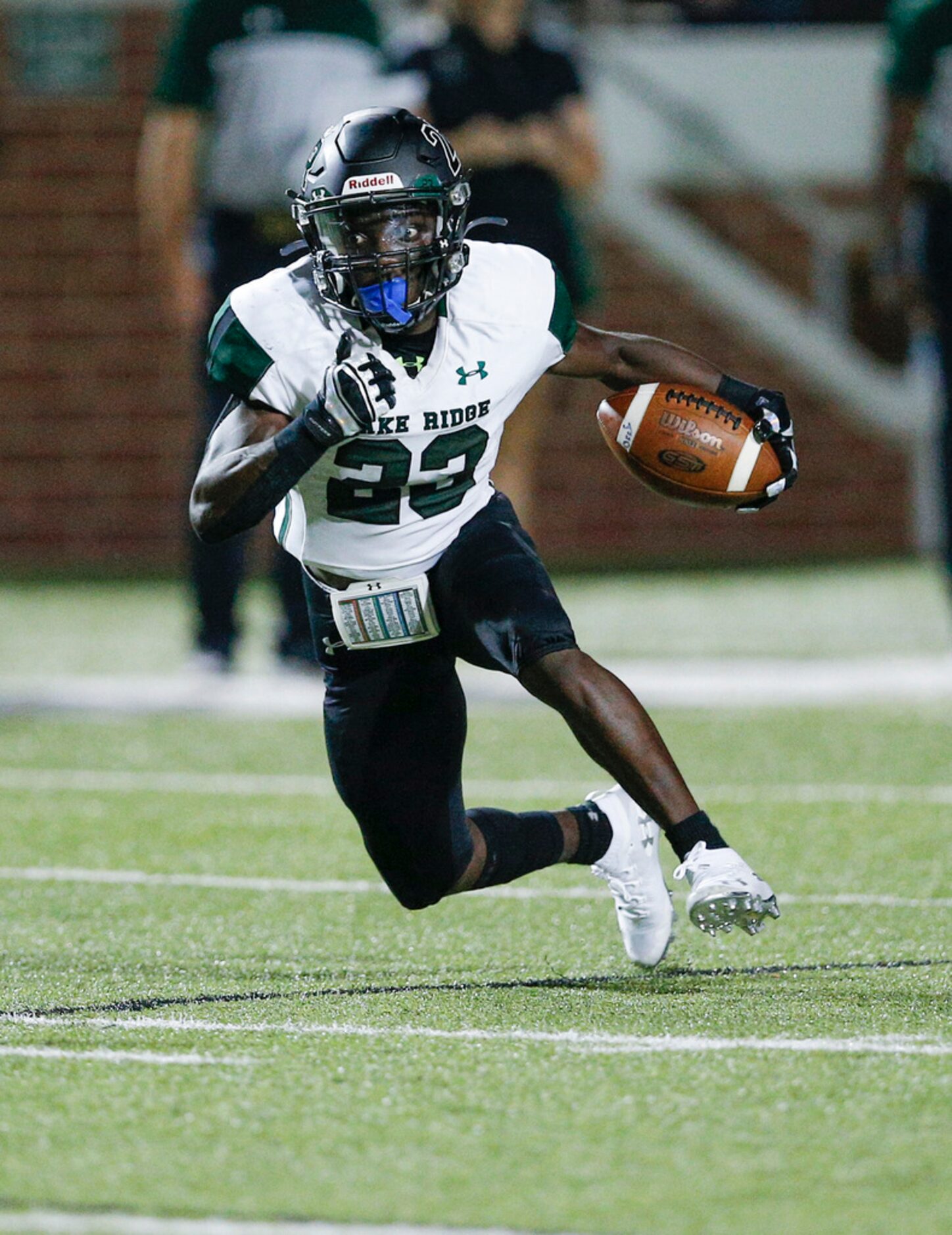 TXHSFB Mansfield Lake Ridge senior wide receiver Tameron Derrough (23) looks for room...