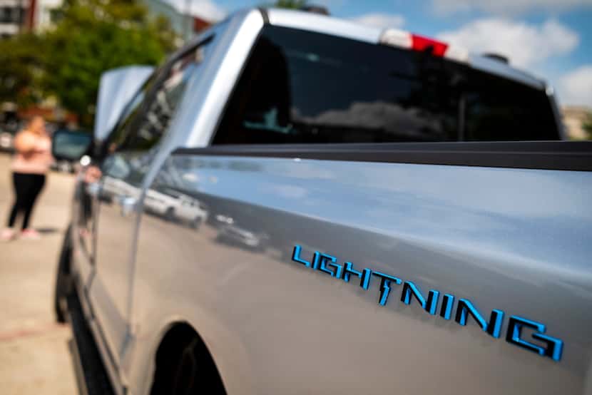 The new electric Ford F-150 Lightning truck was on display during an event for auto dealers,...