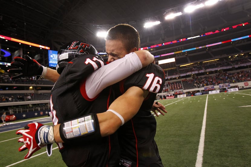 Austin Lake Travis' Jacob Standard (16) and Baker Mayfield (11) embrace as they celebrate...
