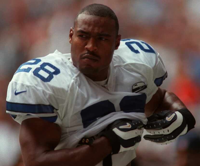 Dallas Cowboys defender Darren Woodson leaves the field after being ejected in the San...