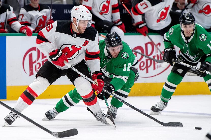 New Jersey Devils left wing Taylor Hall (9) and Dallas Stars center Radek Faksa (12) compete...