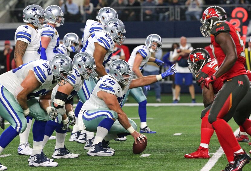 Dallas Cowboys center Travis Frederick (72) makes the call as the Cowboys come to the line...