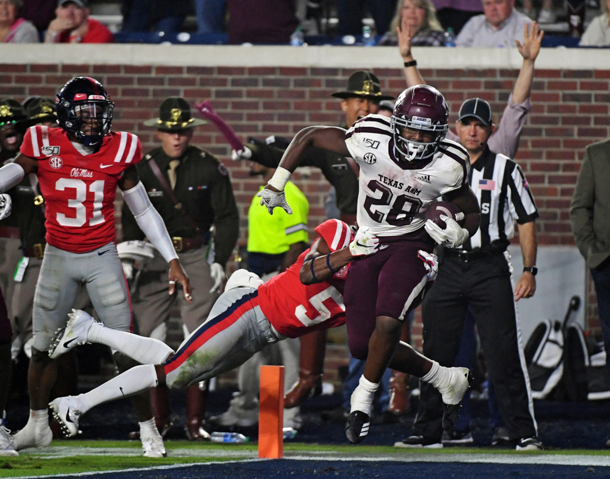 Texas A&M running back Isaiah Spiller (28) carries the ball past Mississippi defensive back...