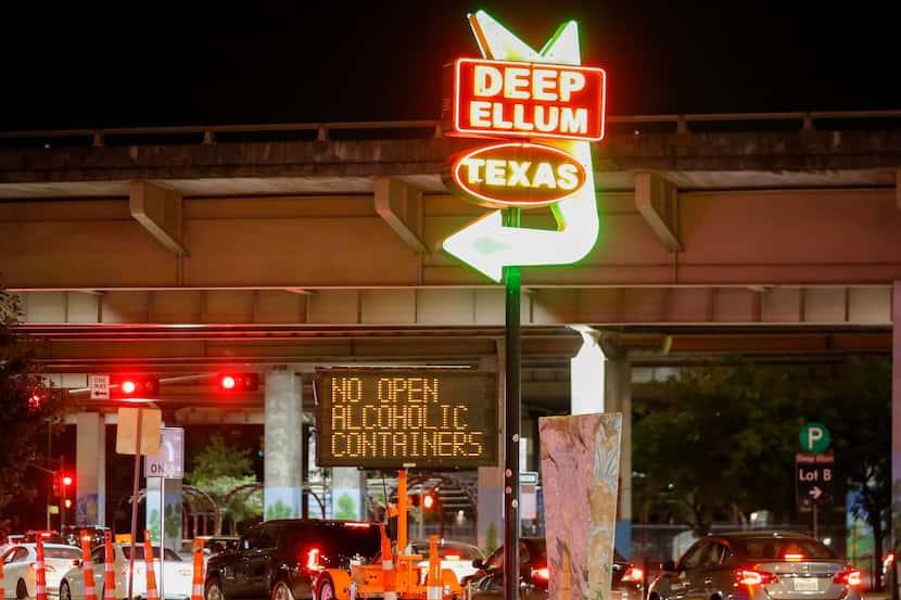 A sign along Good Latimer Expressway in Deep Ellum reminds people of the rule on open...