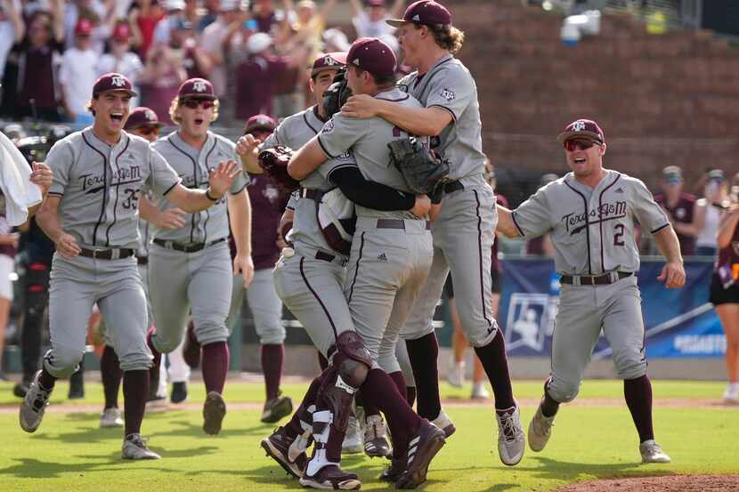 Texas A&M pitcher Jacob Palisch (33) and catcher Troy Claunch (12) celebrate after the final...