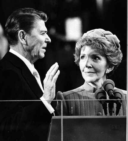 Nancy Reagan watches as her husband Ronald Reagan takes the oath of office in January 1981....