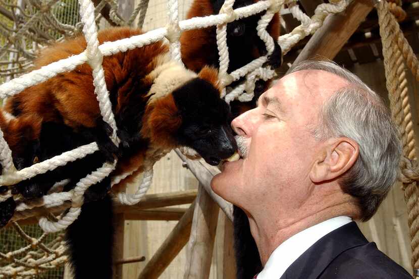 Actor John Cleese feeds a lemur from his mouth at the San Francisco Zoo, Sunday, June 2,...