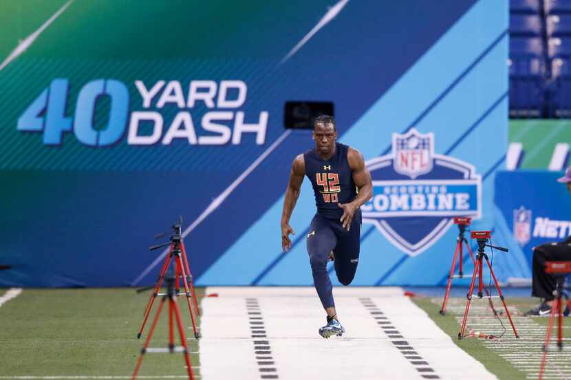 INDIANAPOLIS, IN - MARCH 04: Wide receiver John Ross of Washington runs the 40-yard dash in...