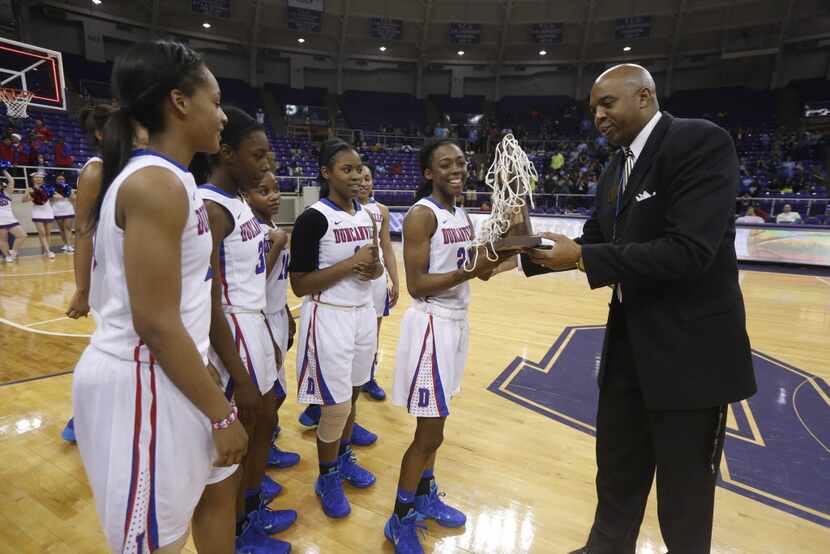 Troy Bell, Forth Worth Assistant Athletic Director presents that Regional trophy to Tasia...