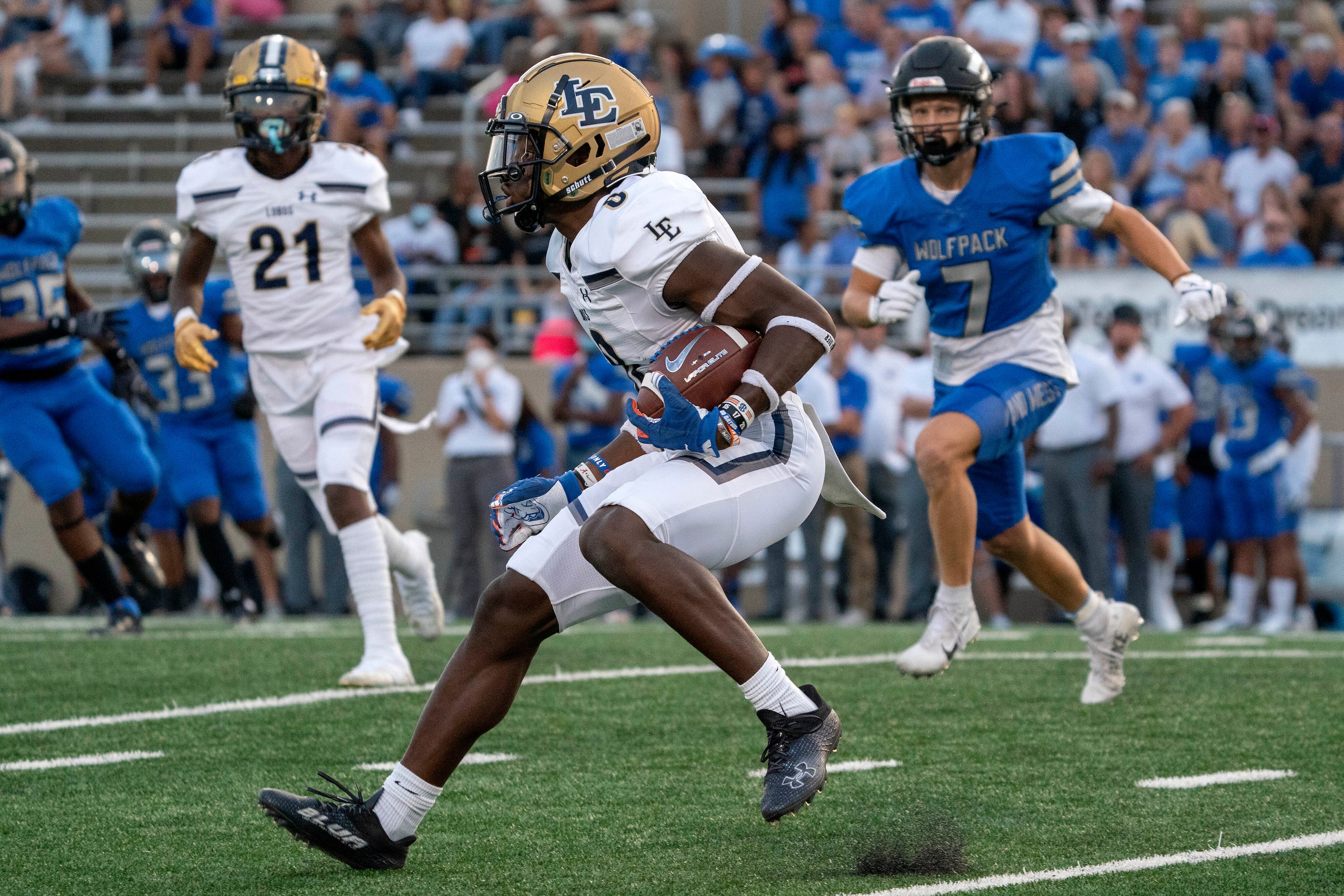 Little Elm senior kick returner Terrance Brooks (8) heads upfield on a kickoff return during...