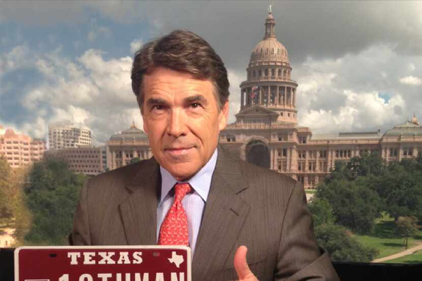  Gov. Rick Perry with most expensive plate sold to date.