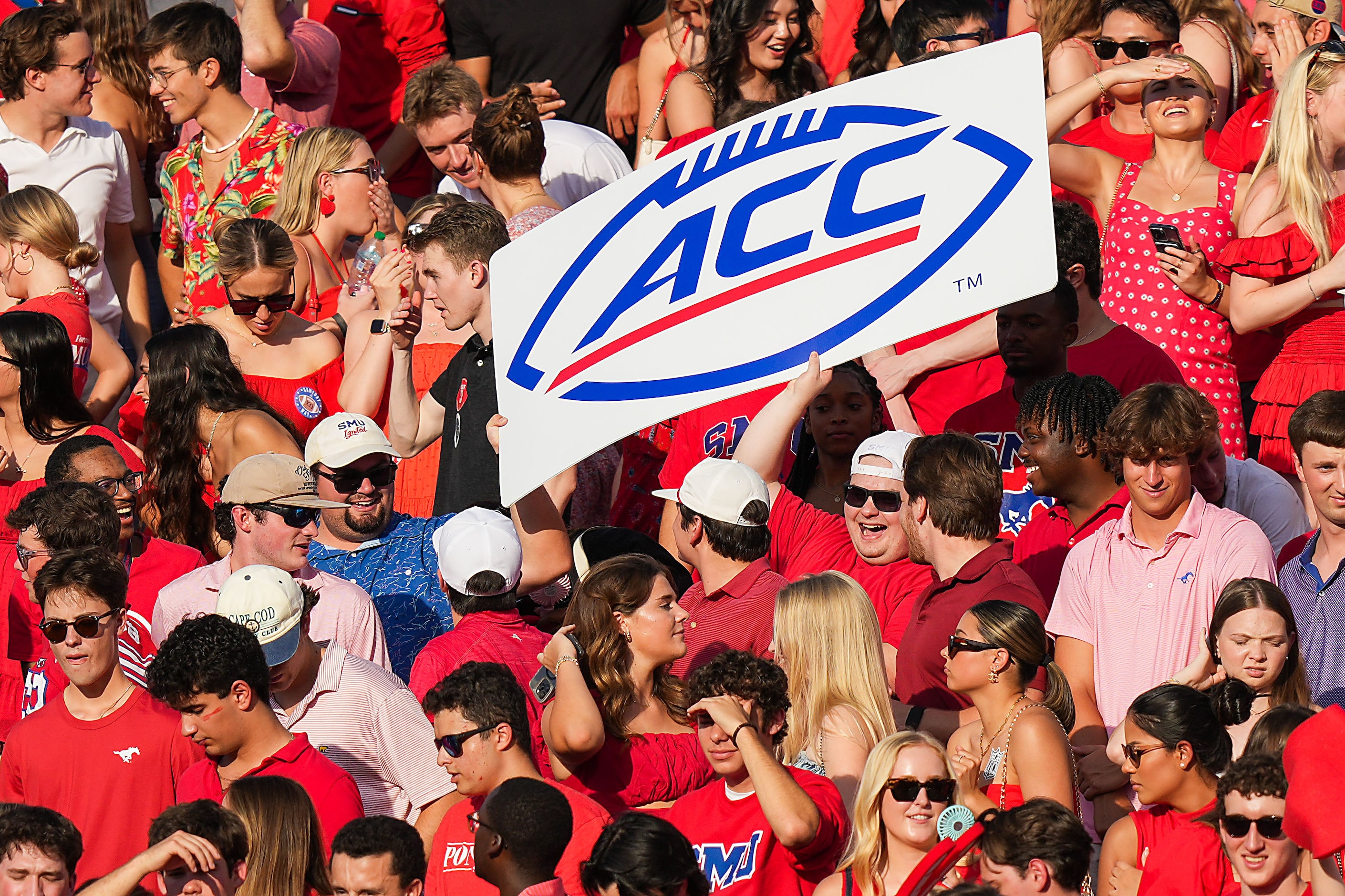 SMU fans hold an ACC sign during the first half of an NCAA football game against BYU at Ford...