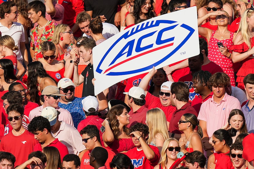 SMU fans hold an ACC sign during the first half of an NCAA football game against BYU at Ford...