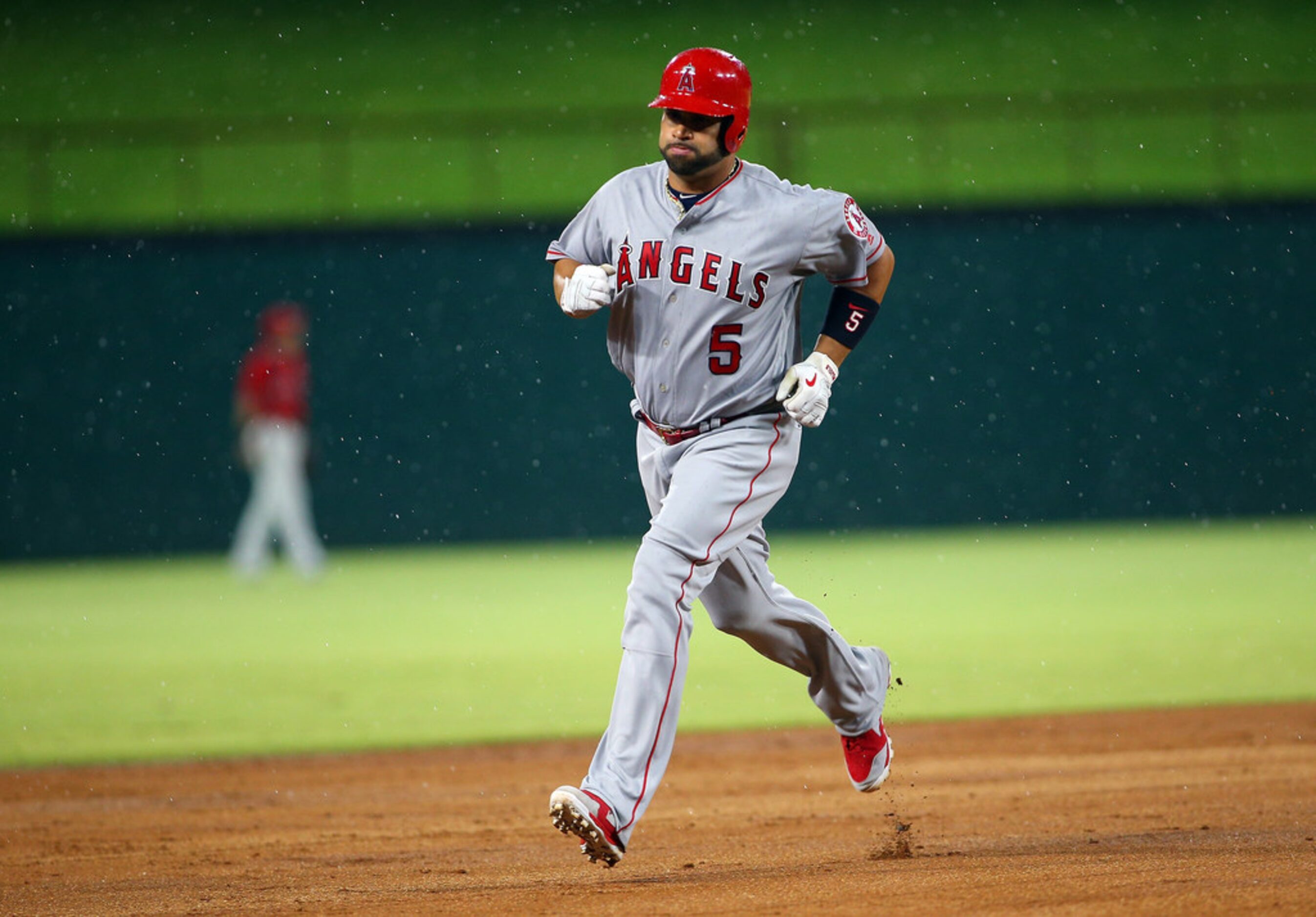 ARLINGTON, TX - AUGUST 18: Albert Pujols #5 of the Los Angeles Angels of Anaheim runs the...