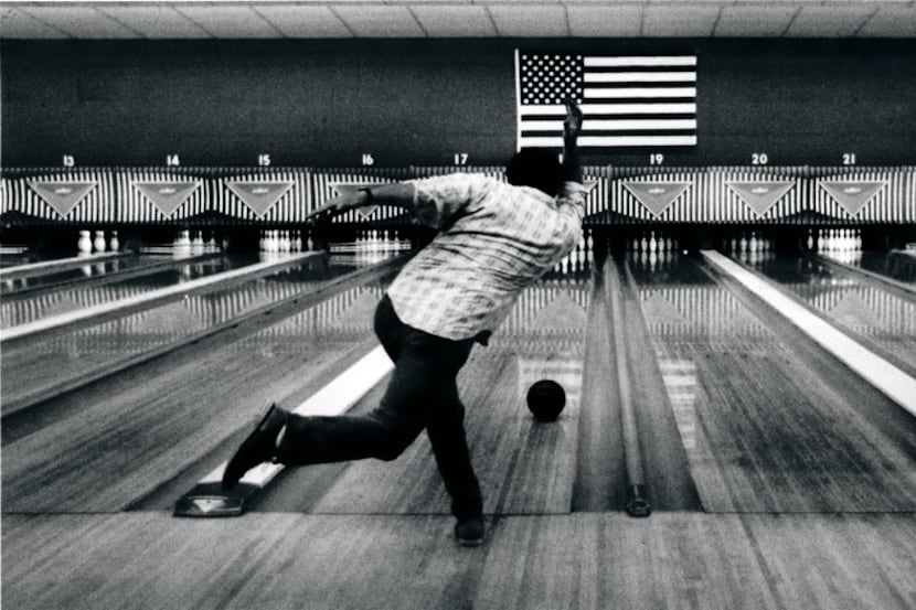 Charlie McPhee took a shot in the Bronco Bowl's lanes in 1990. 