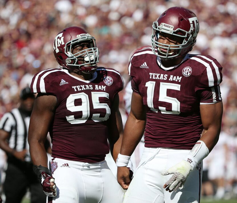 Texas A&M Aggies defensive lineman Myles Garrett (15) reacts after tipping the ball thrown...