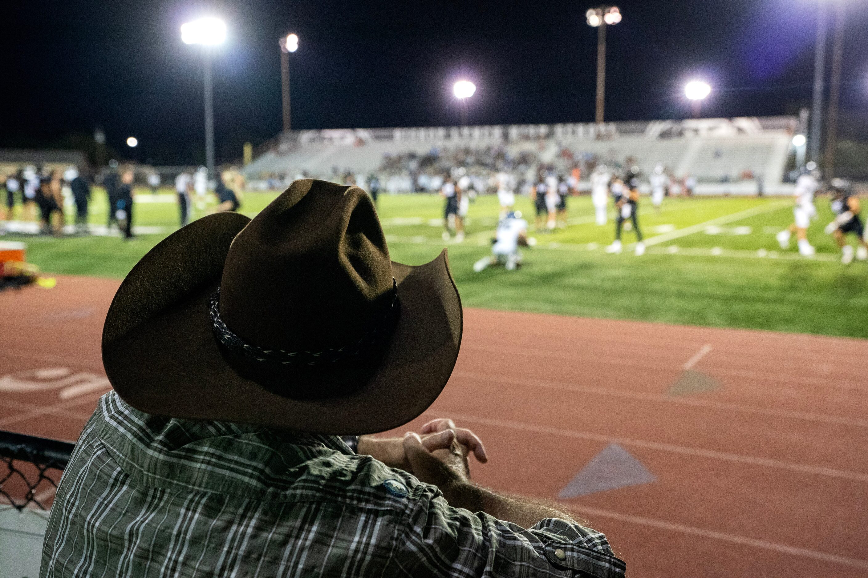 Peter Goodchild, whose son Paul plays in the Bishop Lynch band, watches from the fence...