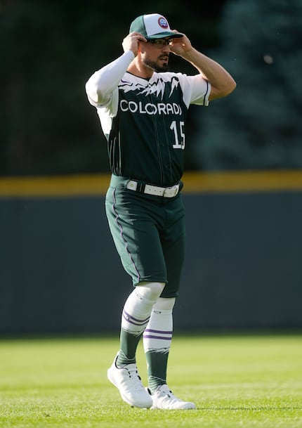 Colorado Rockies right fielder Randal Grichuk warms up in the team's City Connect uniform...