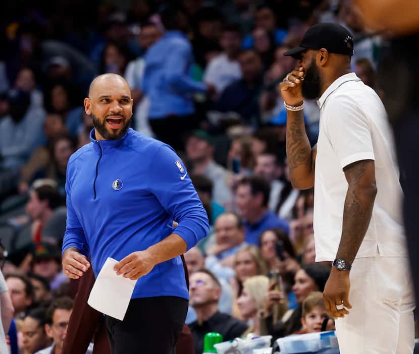 Dallas Mavericks assistant coach Jared Dudley speaks to former teammate and Los Angeles...