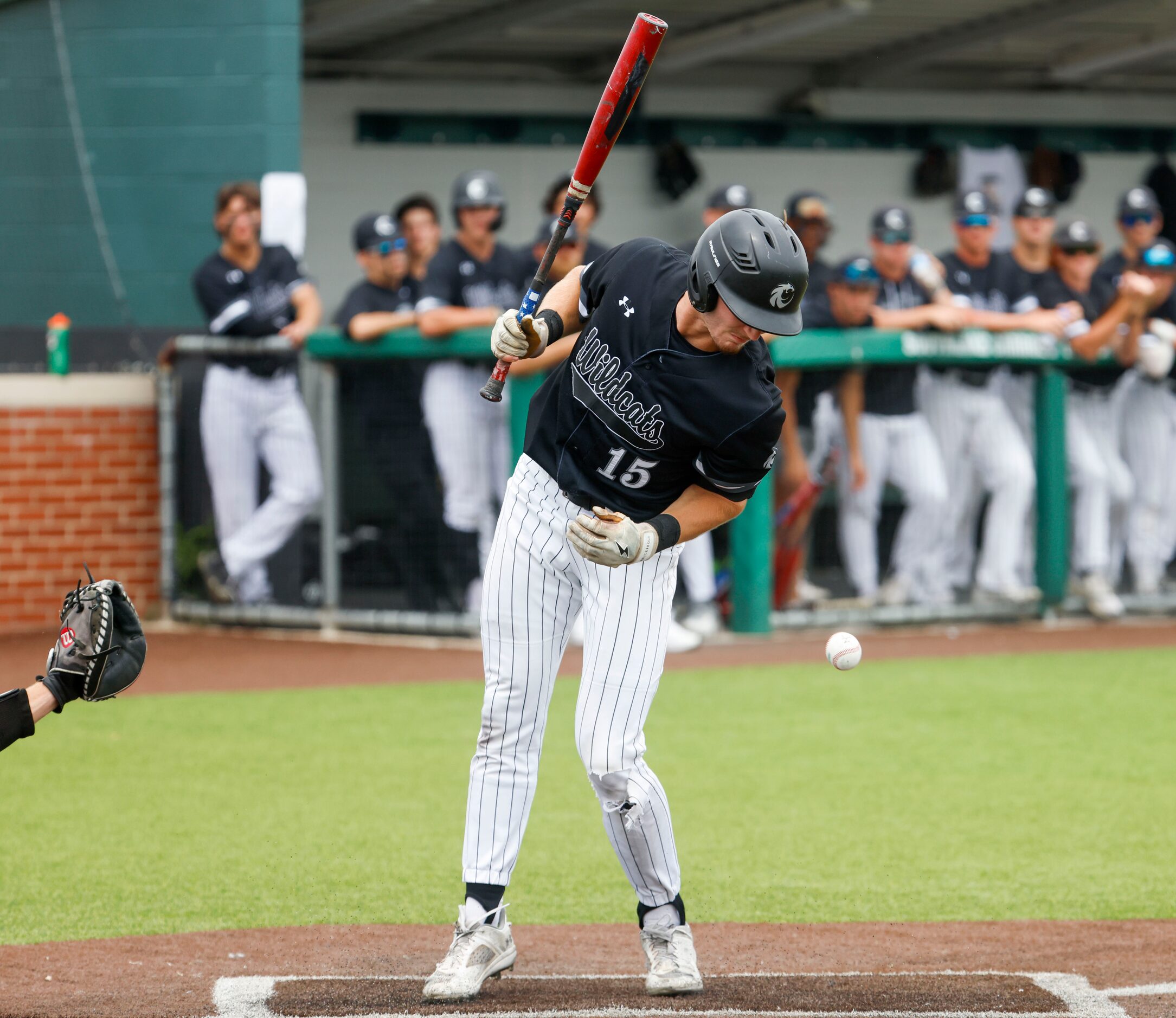 Denton Guyer’s Lane Allen gets hit by a ball during the second inning of a baseball game...