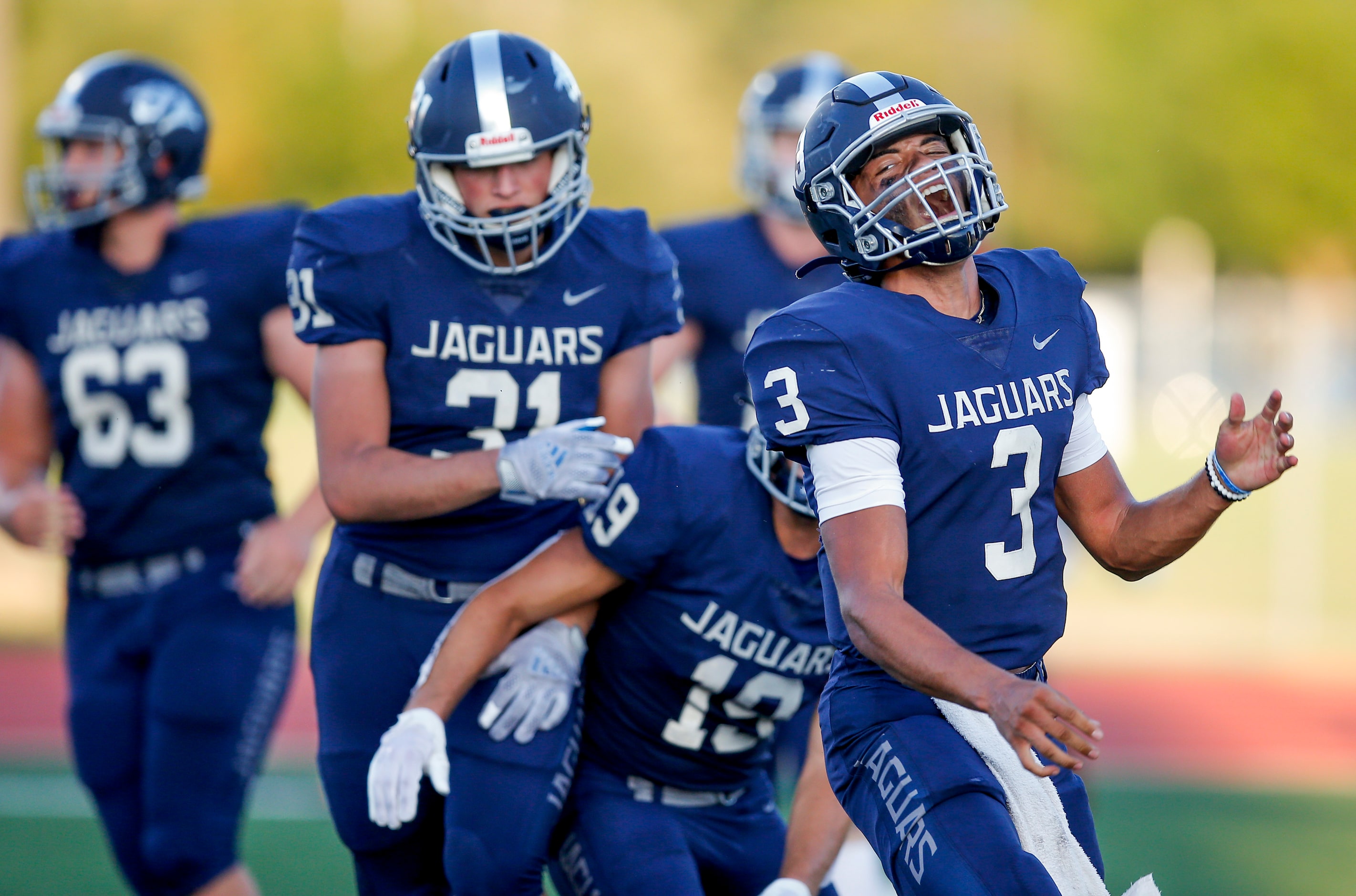 Flower Mound senior quarterback Nick Evers (3) celebrates scoring a touchdown during the...