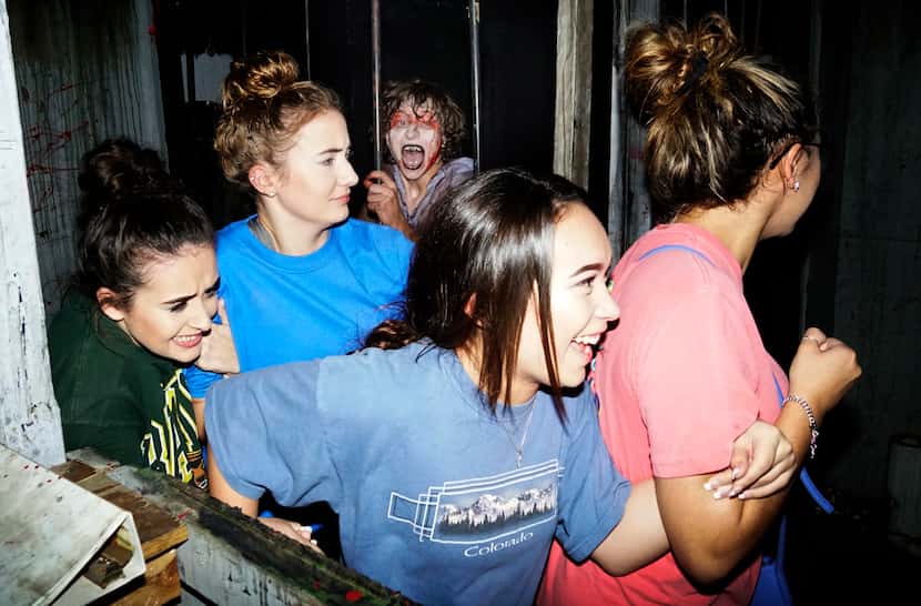 A group of attendees sticks together at Hangman's House of Horrors in Fort Worth in 2017.