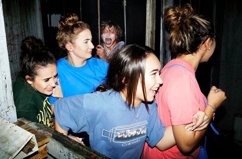 A group of attendees sticks together at Hangman's House of Horrors in Fort Worth in 2017.