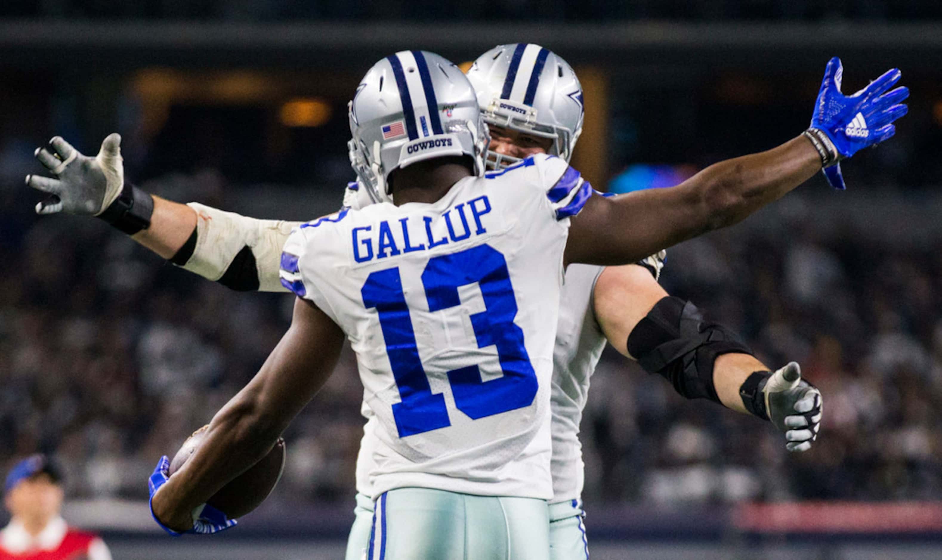 Dallas Cowboys wide receiver Michael Gallup (13) celebrates a touchdown with offensive guard...