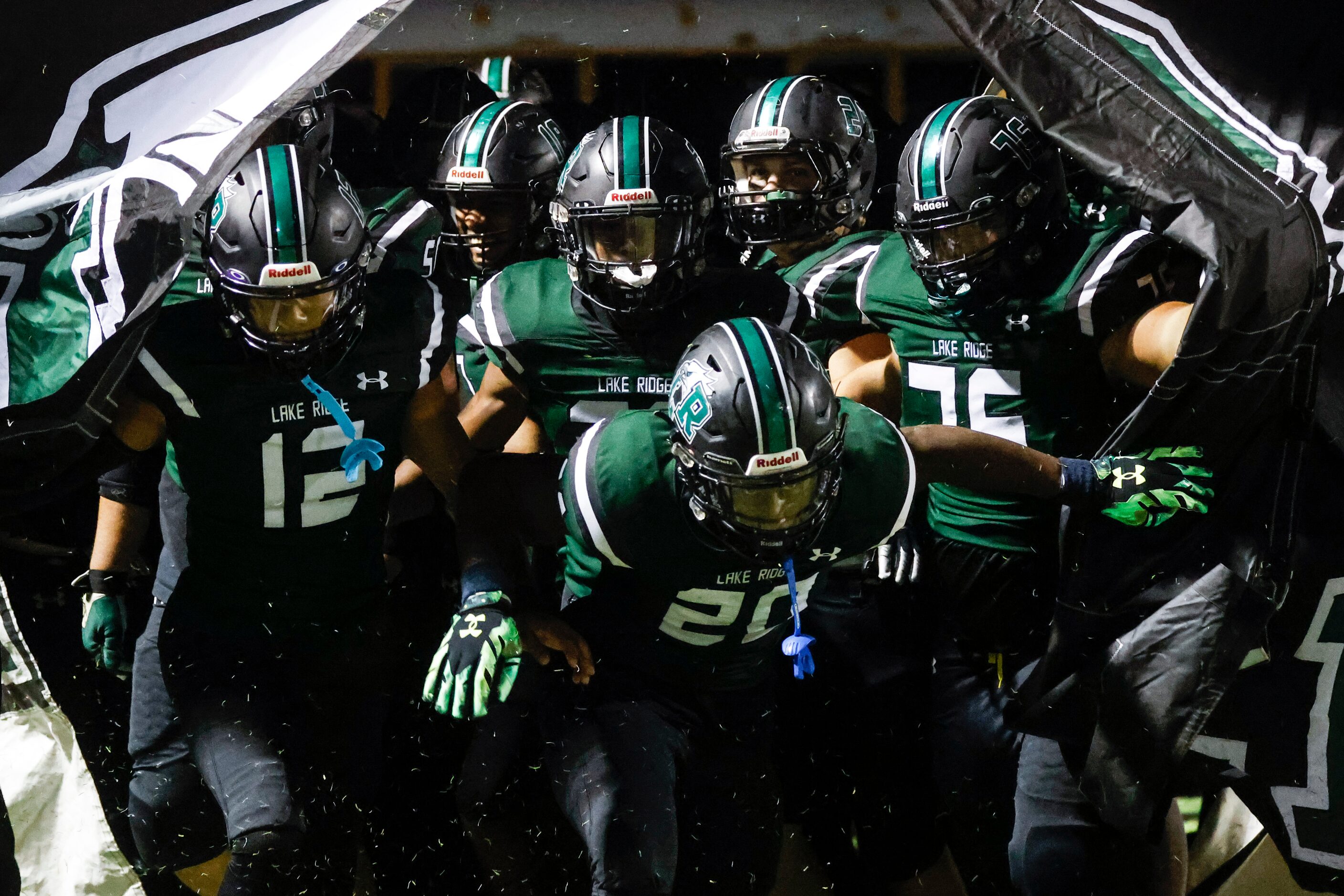 Lake Ridge players enter the field during the second half of a football game against DeSoto...