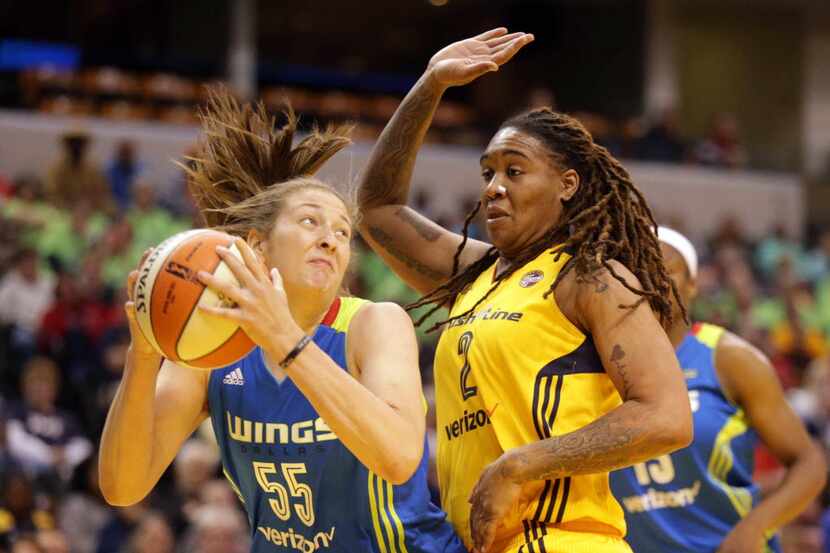 Dallas Wing's Theresa Plaisance, left, and the Indiana Fever's Erlana Larkins, right, grab...