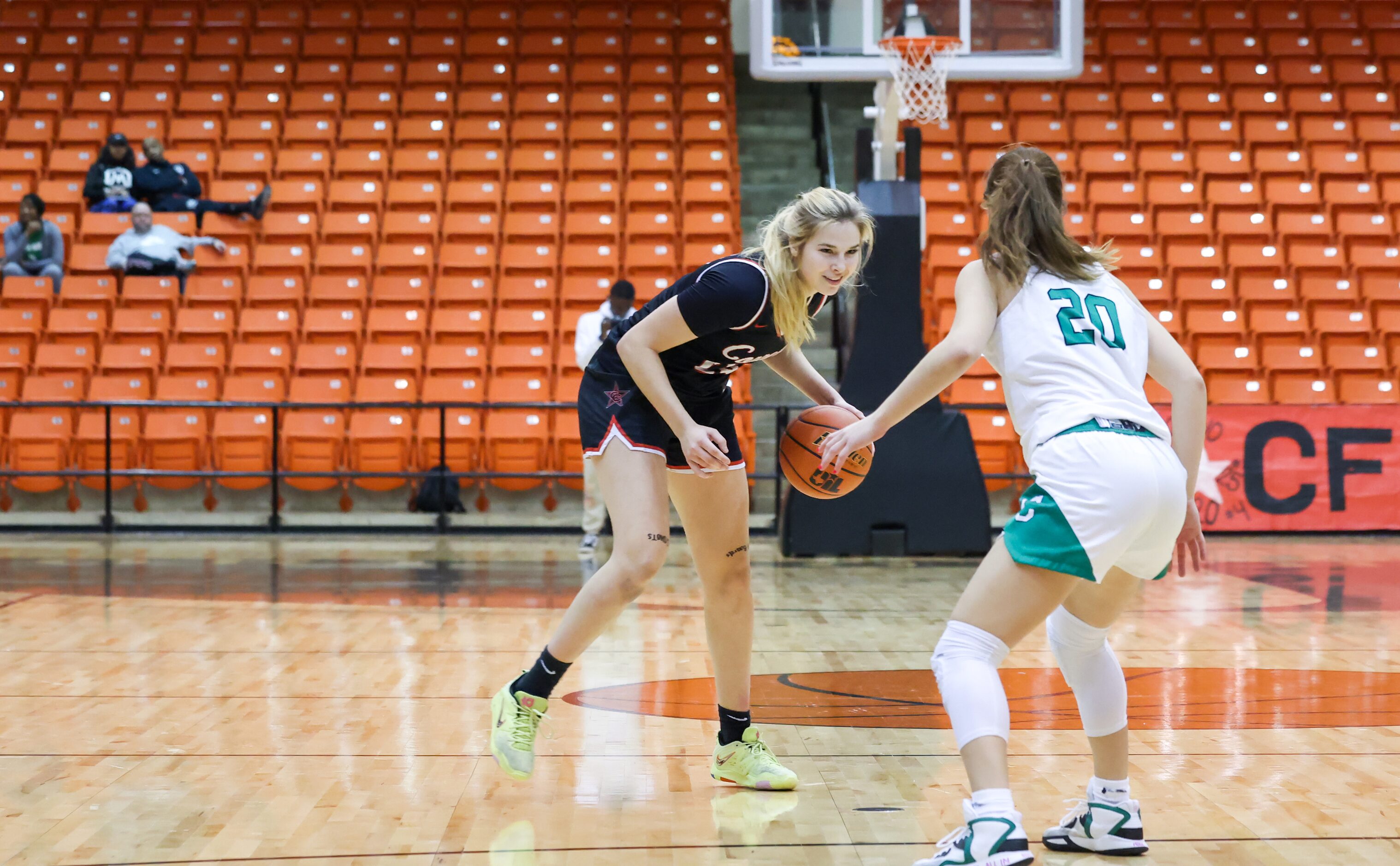 Coppell senior guard Julianna LaMendola (20) smiles as she advances toward Southlake Carroll...