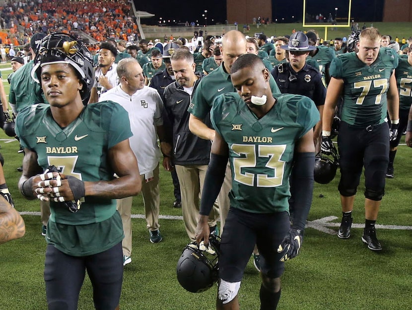 Baylor players walk off the field following a 17-10 loss to UTSA in an NCAA college football...