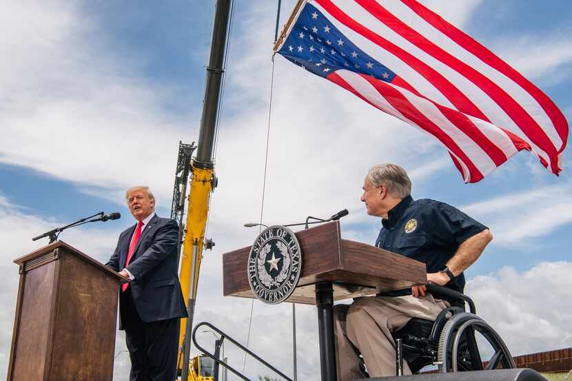 Gov. Greg Abbott listens to former President Donald Trump's address during a tour to an...