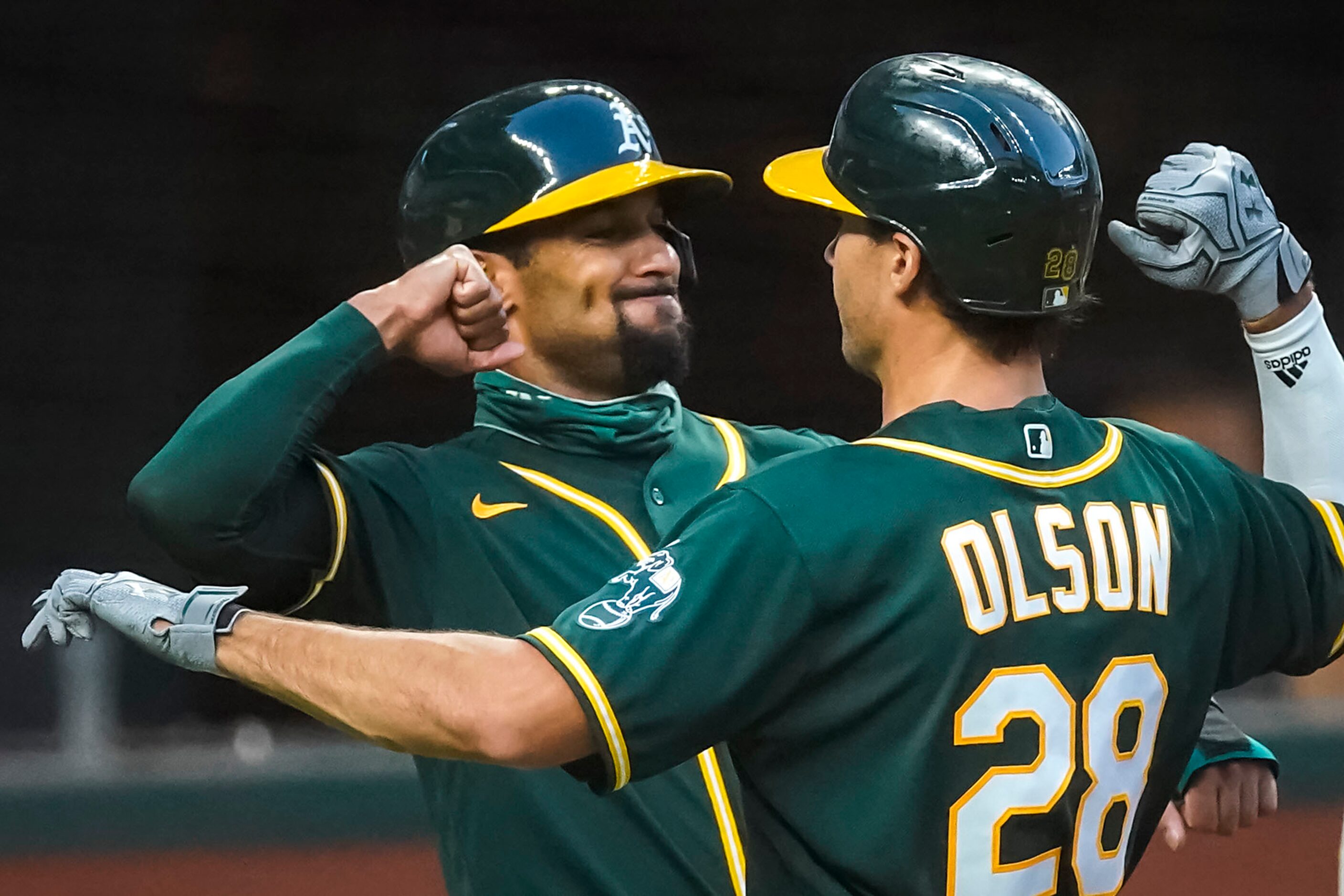 Oakland Athletics first baseman Matt Olson celebrates with shortstop Marcus Semien after...