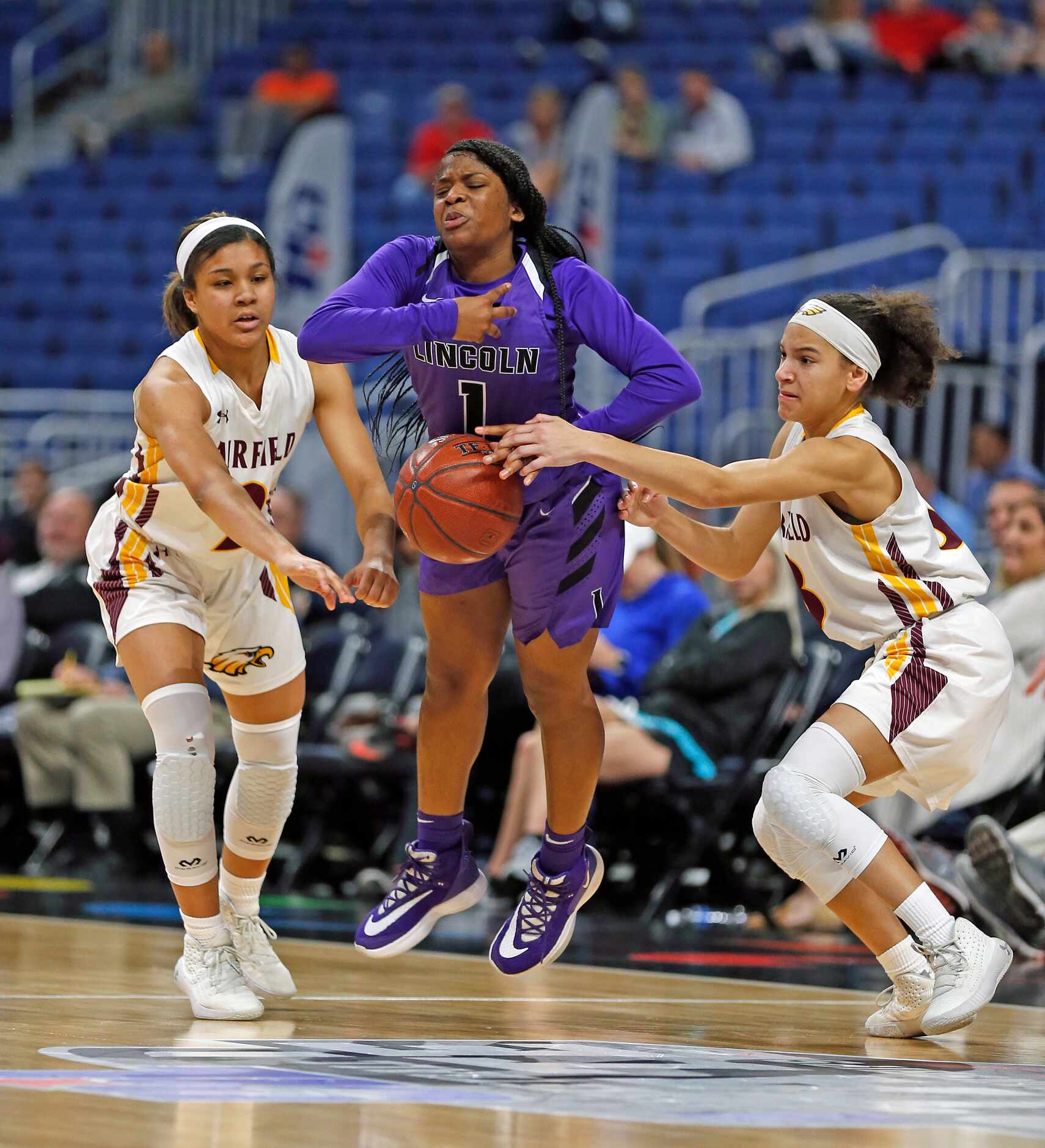 Lincoln guard Alexis Brown (#1) is stripped of the ball by Fairfield guard Jada Clark (#2)...