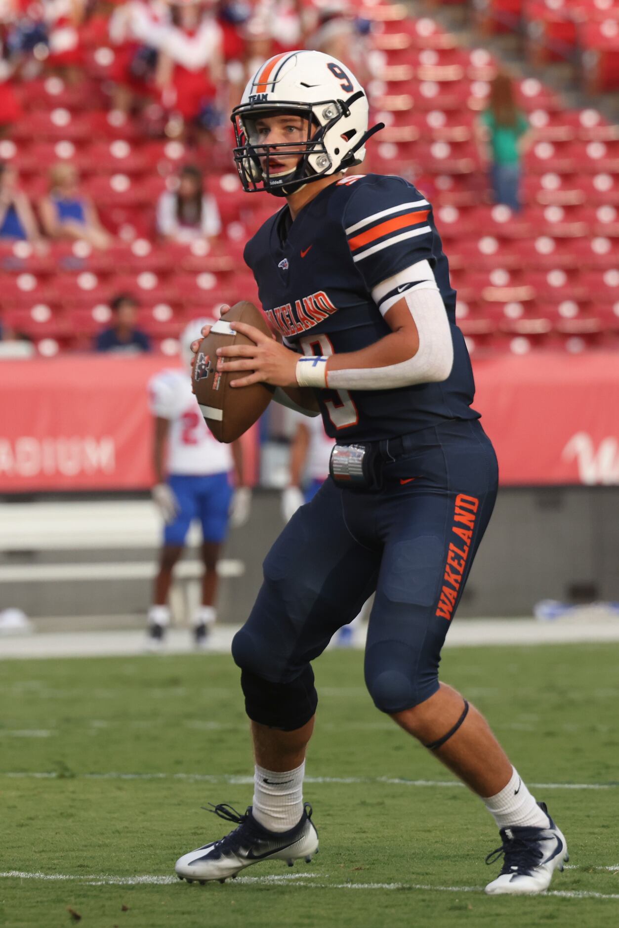Wakeland High School’s quarterback Brennan Myer (9) looks to throw a pass during the first...